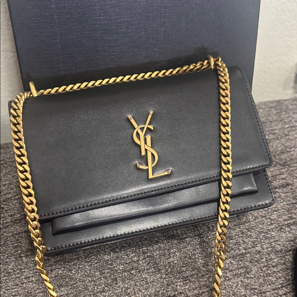 Yves Saint Laurent Black Crossbody Bag with Gold Chain.